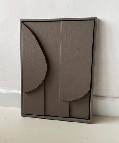 Handmade abstract art piece with geometric shapes in monochrome tones.