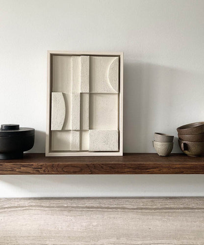 Art piece #20.15 Celia made from biodegradable PLA with sand texture and eco-paint, displayed on a wooden shelf.