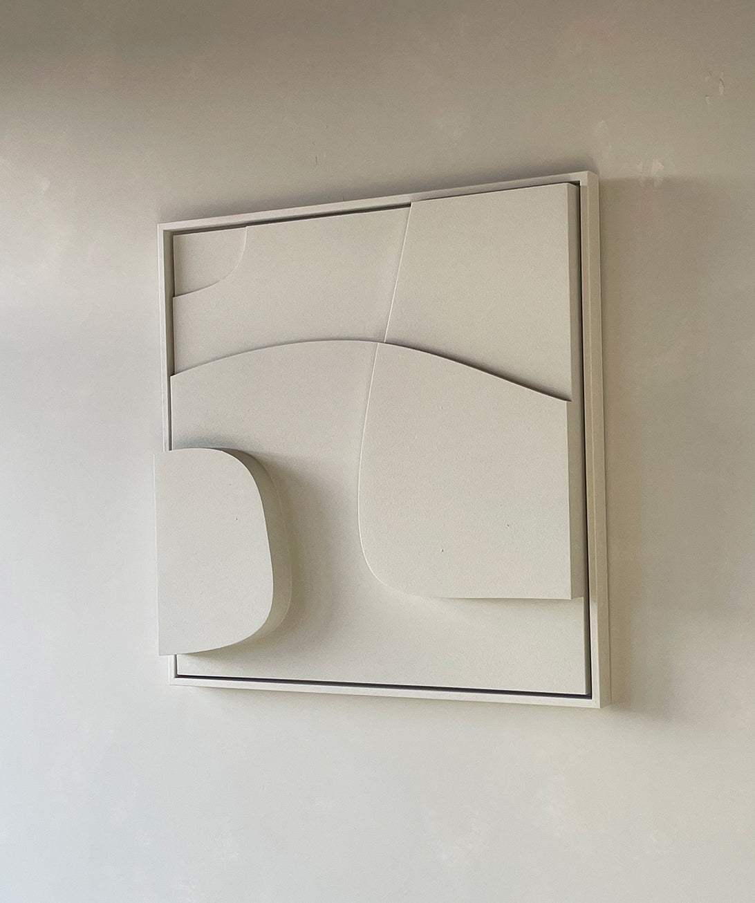 Minimalist geometric wall art made from biodegradable PLA with sand texture and eco-paint.