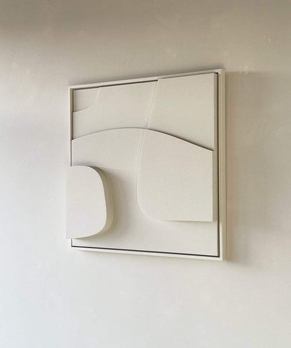 Handmade 3D art piece with sand texture finish in white frame.