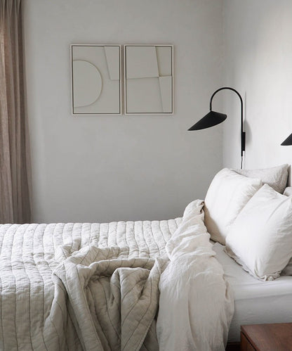 Wall-mounted art pieces "Shape #6.1 + #6.2" with minimalist design in a cozy bedroom setting.