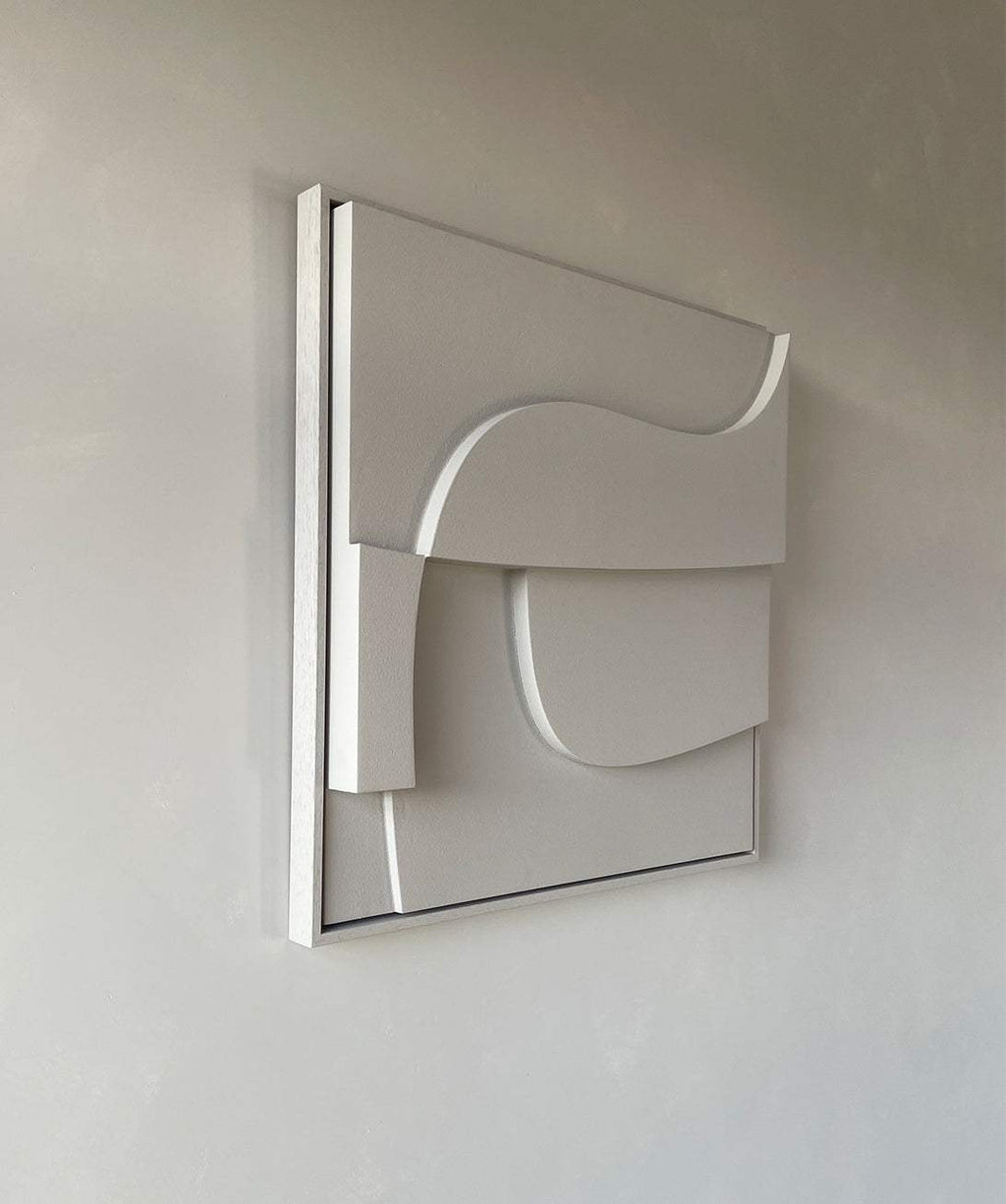 Handmade geometric wall art with sand texture and eco-paint finish.