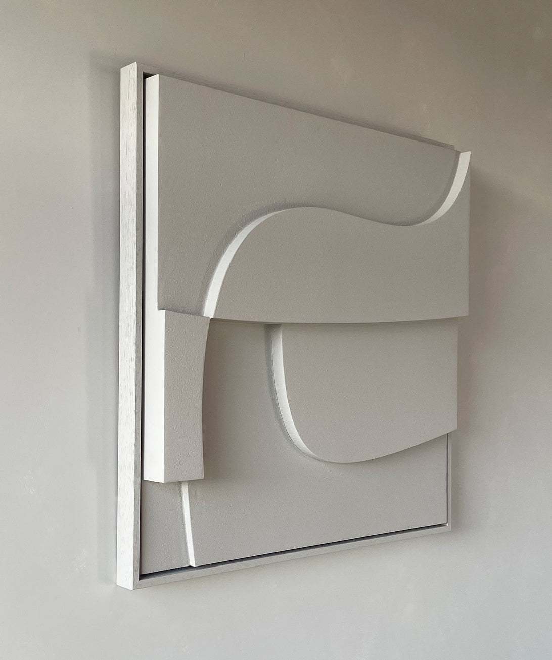 Handmade modern wall art with layered geometric design in neutral tones.