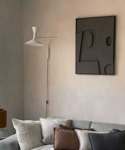 20.3 Moon artwork made from biodegradable PLA with sand texture and eco-paint, displayed above a sofa.