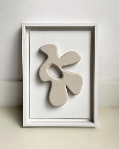 23.1 Bird artwork in a white frame made from biodegradable PLA with sand texture and eco-paint.