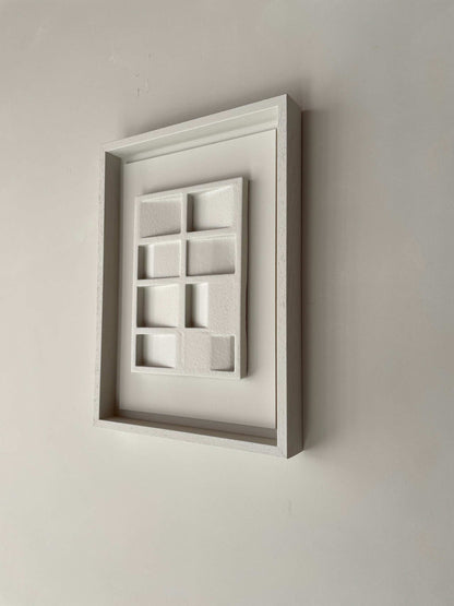 Wall art made of biodegradable PLA material with sand texture and eco-paint in a white rectangular frame, titled 23.3 Pella.