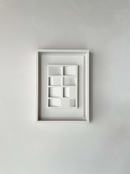 Modern artwork '#23.3 Pella' in a white frame, made from plant-based PLA with a sand-textured eco-paint finish.