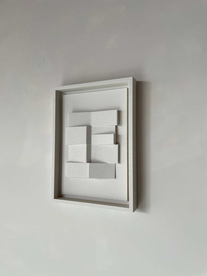 Hand-made 23.4 Zigzag wall art with geometric design, eco-friendly materials, and sand texture finish in a white frame.