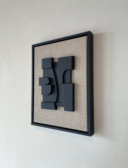 Canvas Nonna artwork with anthracite black frame and structured plaster on canvas background.