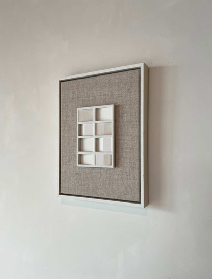 Canvas Pella artwork with shadow white frame and structured plaster finish.