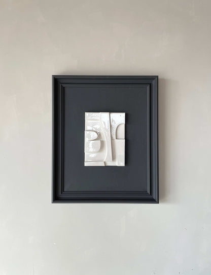 Vintage Frame Alphie with shiny white artwork and anthracite frame, 59.5 x 49.5 cm, by Edith Beurskens.