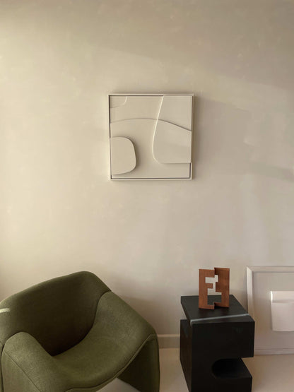 Handmade 3D art piece with abstract design on wall, eco-friendly materials.