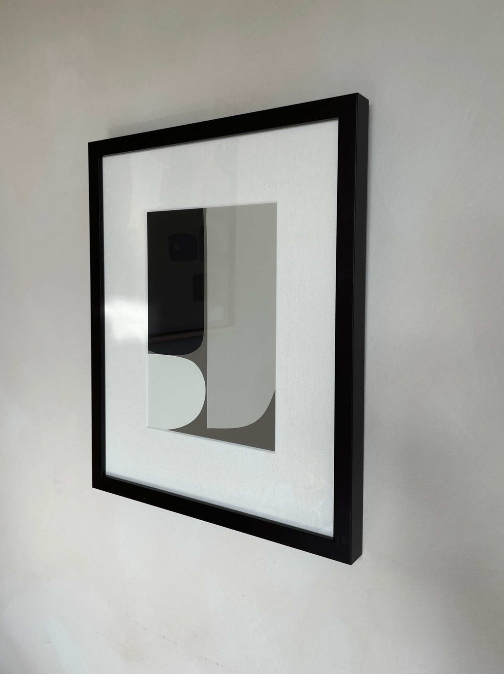 Art print titled "Ingrid" with minimalist design, displayed in a black frame.