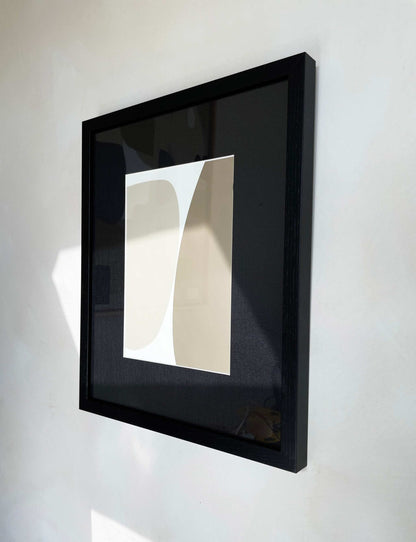 Art print with abstract motif on premium Hahnemühle paper, displayed in a black frame.