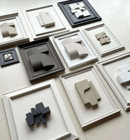 Assorted vintage frames with unique artwork by Edith Beurskens, made from plant-based PLA, featuring matte anthracite and shadow white colors. Frame size: 55 x 47.5 cm.