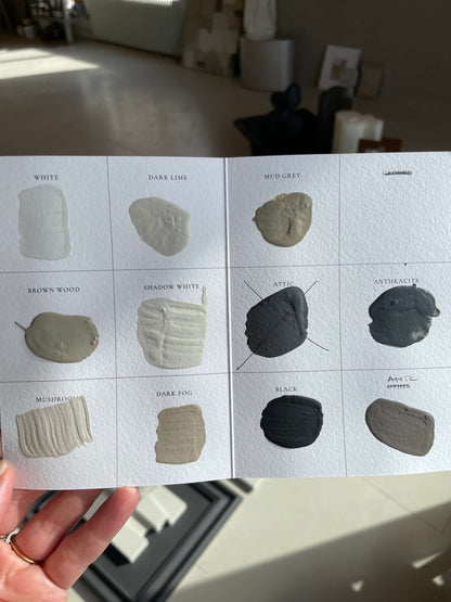 Color palette card featuring various shades including white, dark lime, mud grey, brown wood, shadow white, attic, anthracite, mushroom, dark fog, and black.