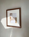 High-quality 'Rika' art print with matte finish and 1 cm white border, displayed in a wooden frame.