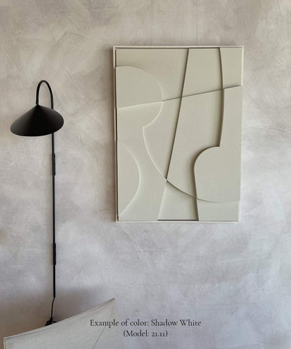 Minimalist wall art titled "#21.11 Cos" in Shadow White, featuring geometric design mounted on a textured wall.