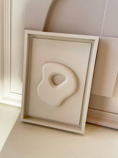 Organic Stone artwork in shadow white with sand texture finish, eco-painted by Edith Beurskens, framed size 30 x 21 cm.